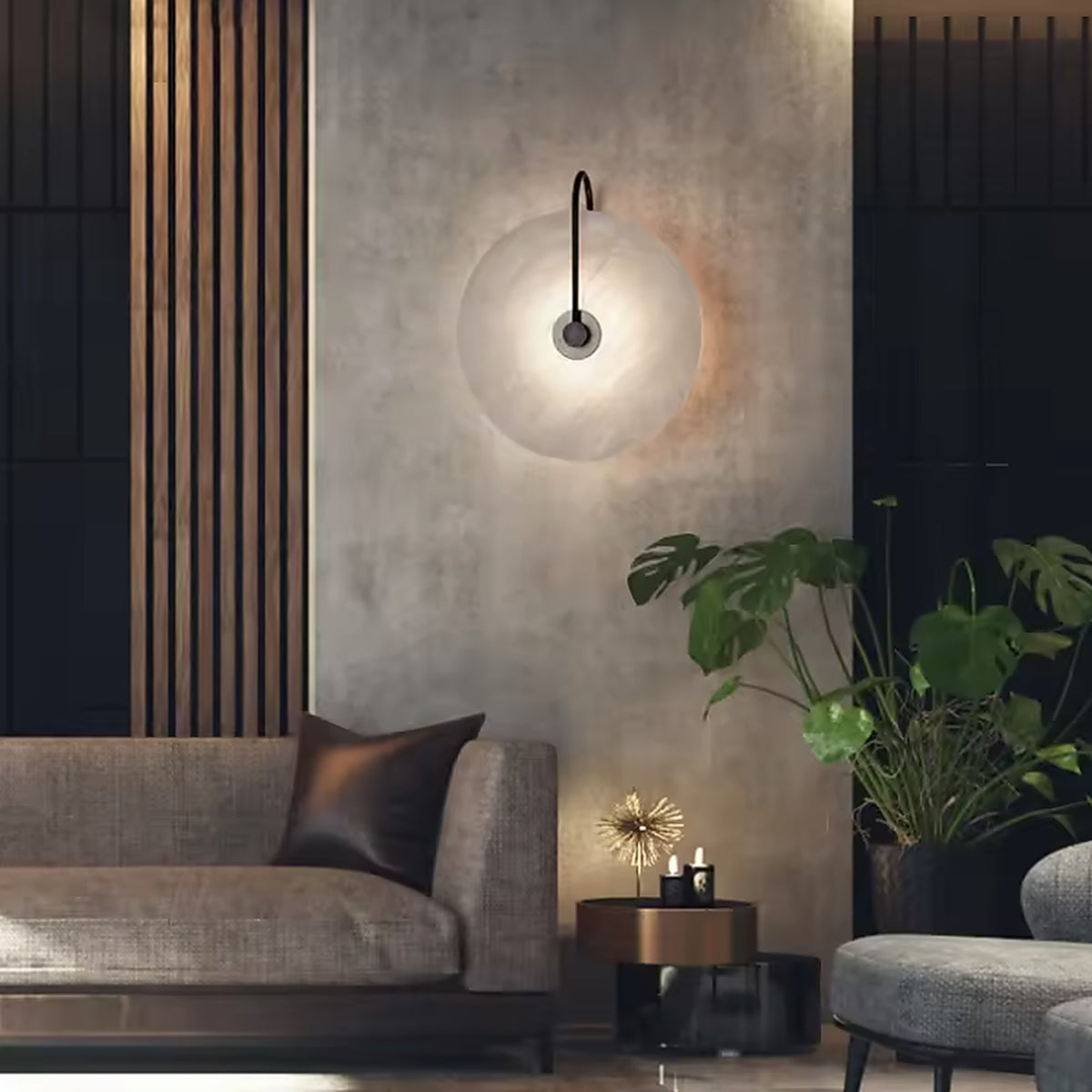 Alabaster disc wall sconce above a sofa in a modern living room