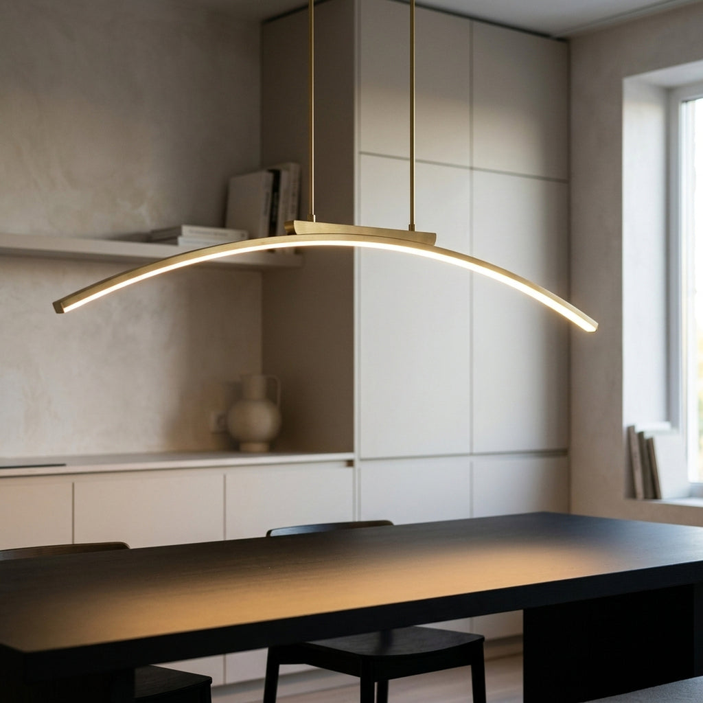 Gold arc LED chandelier switched on above a black dining table