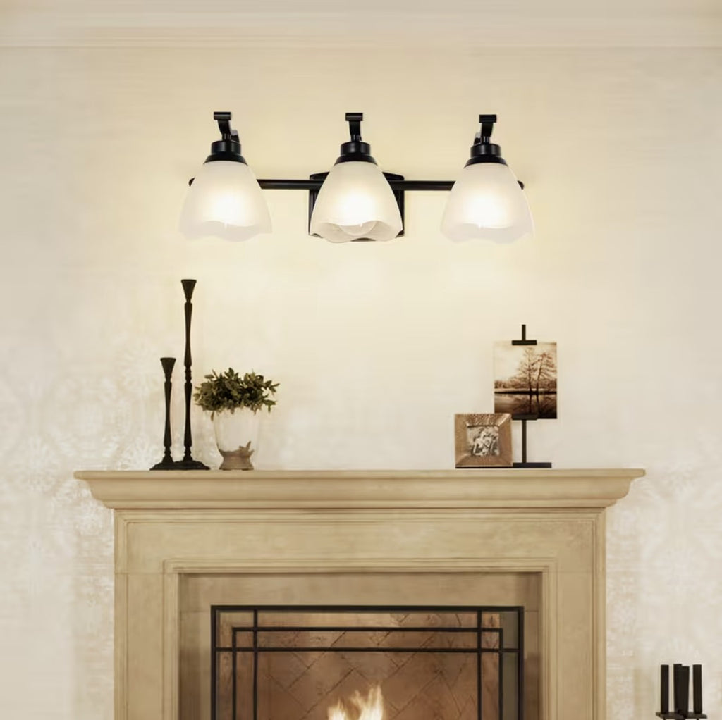 Bathroom vanity light above a fireplace mantel