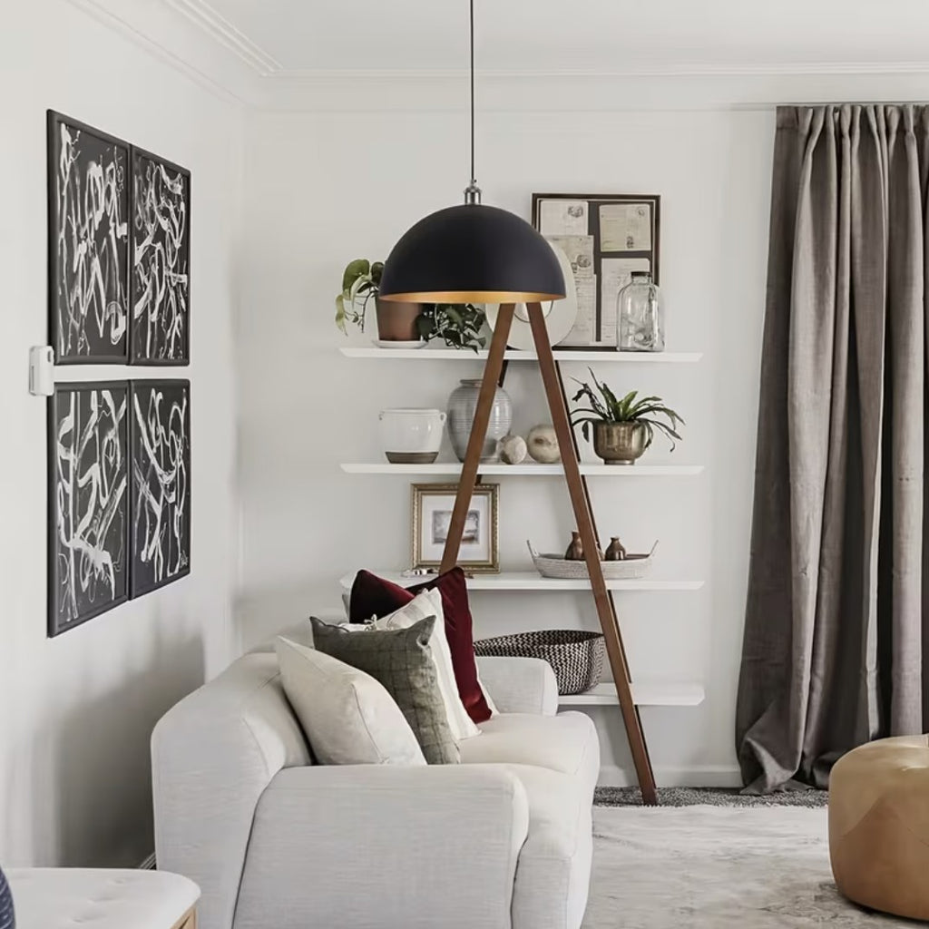 Black and gold dome pendant light in a living room