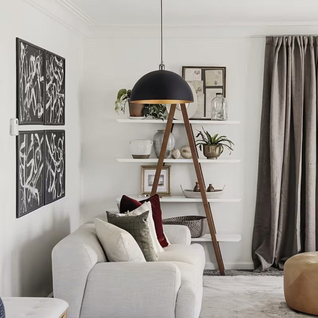 Black and gold dome pendant light in a living room