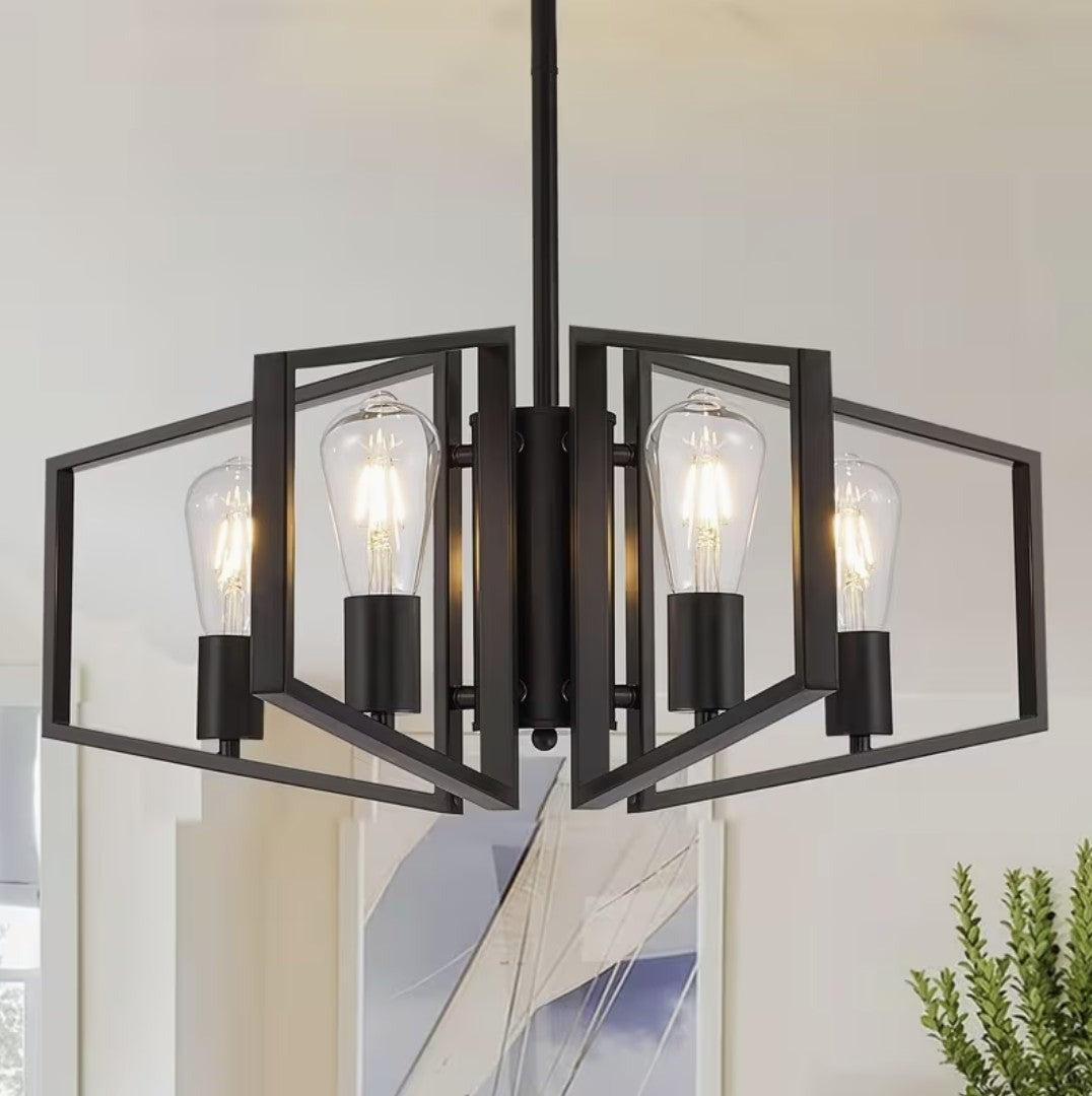 Black iron geometric chandelier with 4 open frames and Edison bulbs above a dining area