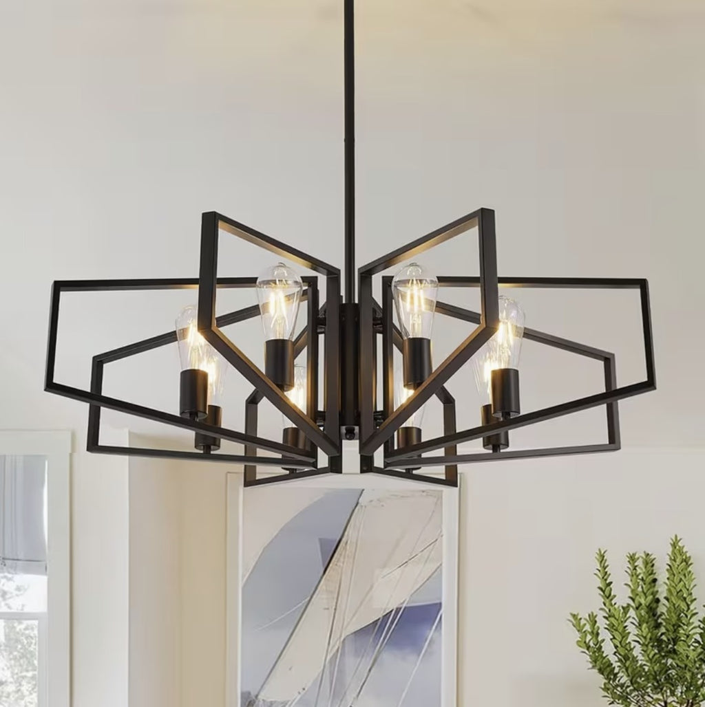 Black iron geometric chandelier with 8 open frames and Edison bulbs above a dining area