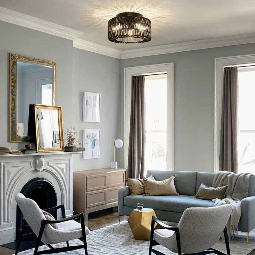 Black boho flush mount ceiling light in a living room with fireplace