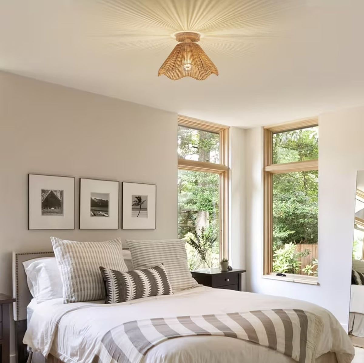 Boho woven ceiling light fixture above a bed, casting a radiating pattern on the ceiling