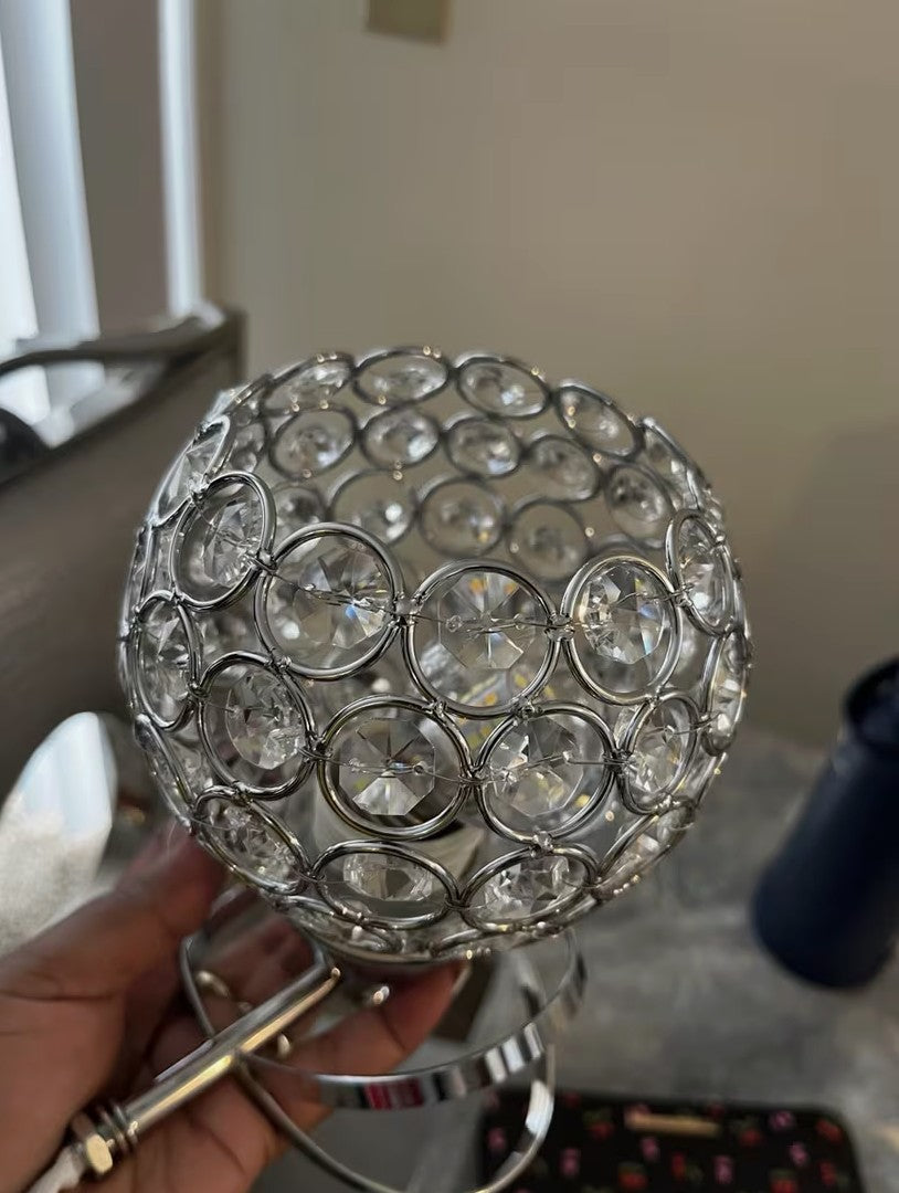 Close up of the cut crystal globe and its metal frame Image