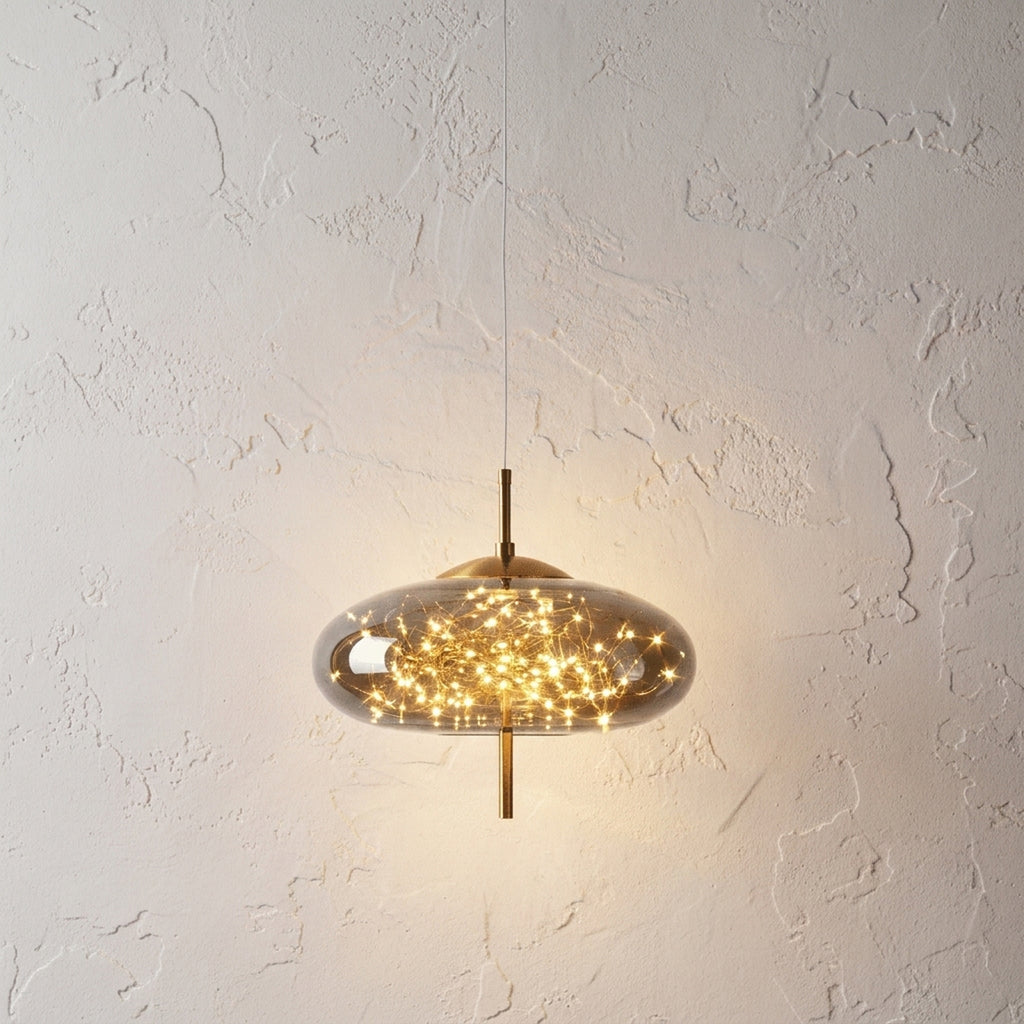 Smoky grey glass disc pendant light lit by a cluster of tiny warm LED filaments