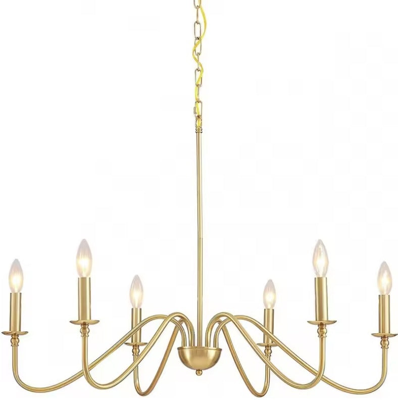 Gold farmhouse candle chandelier with six curved arms and candle sleeves