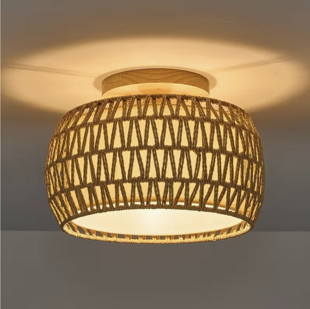 Farmhouse flush mount ceiling light in woven rope, lit on a ceiling