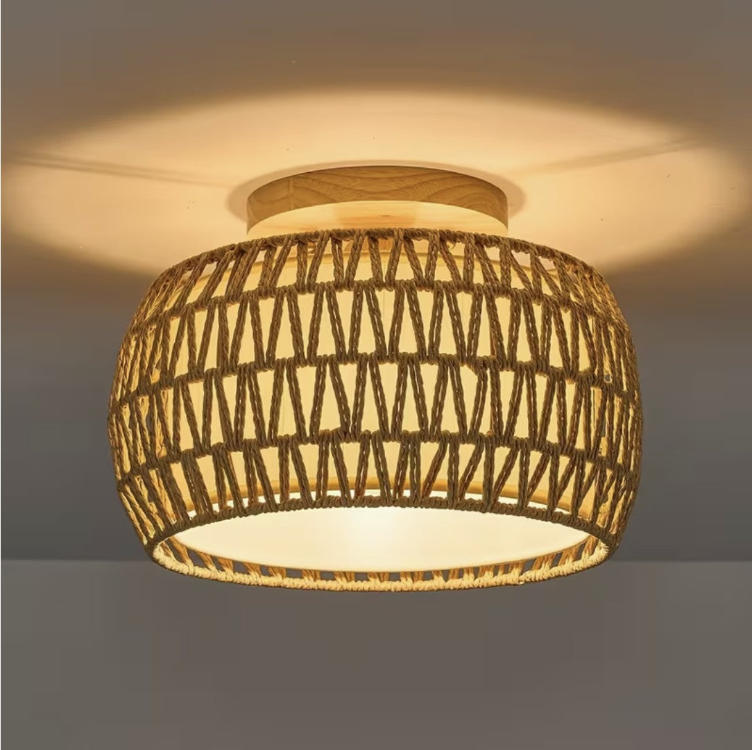 Farmhouse flush mount ceiling light in woven rope, lit on a ceiling