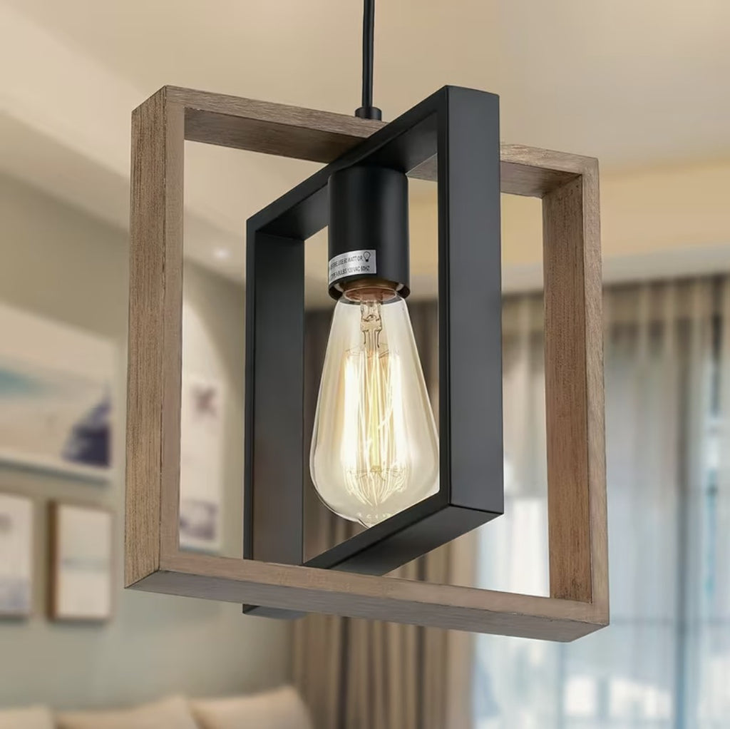 Close up of the wood and black metal frames and the filament bulb