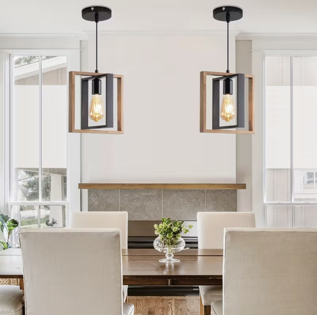 Two farmhouse pendant lights above a dining table Image