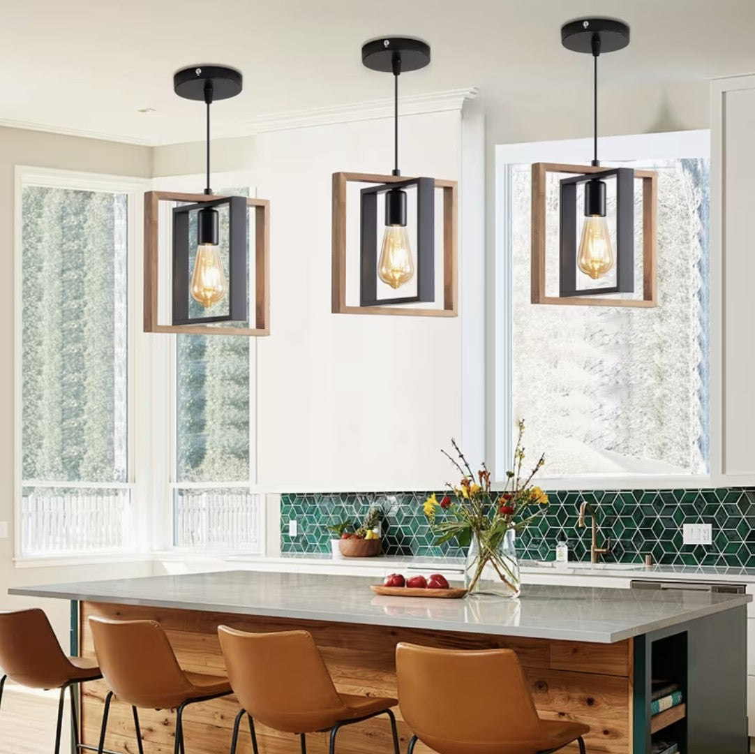 Three farmhouse pendant lights above a kitchen island