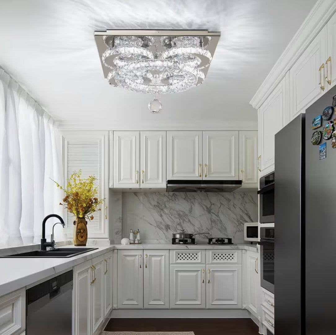 Flush mount crystal chandelier in a white kitchen