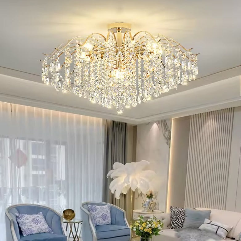 Gold crystal flush mount ceiling light in a bright living room with high ceilings