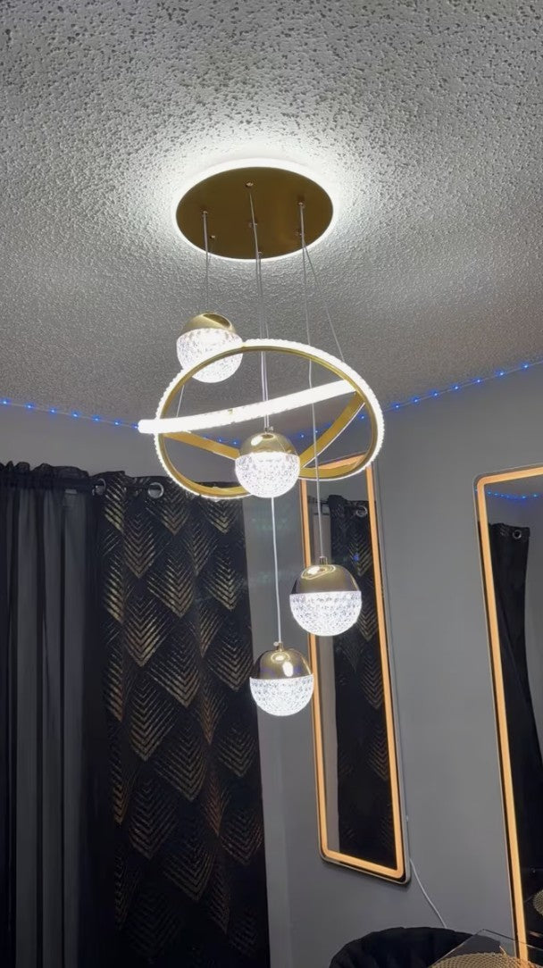 Customer photo, gold globe chandelier in a bedroom