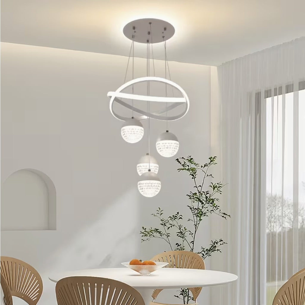 White LED globe chandelier above a dining table