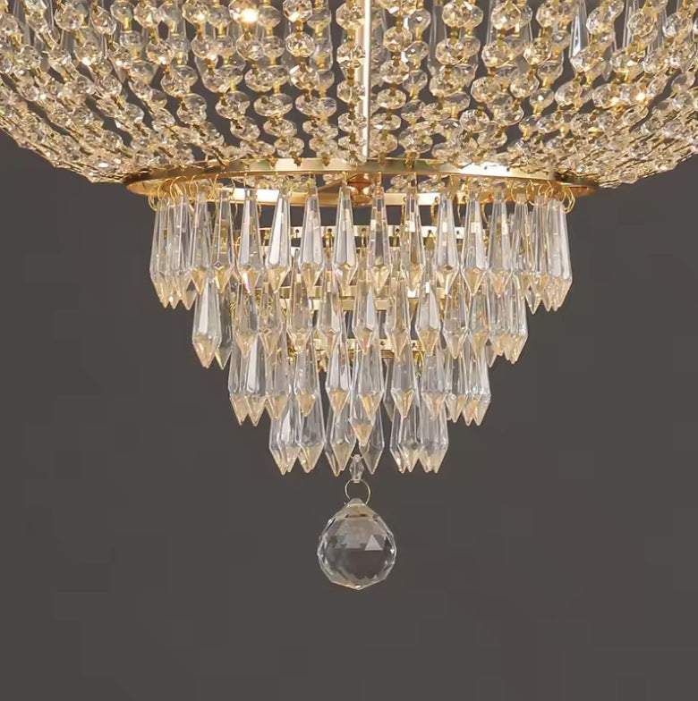 Close up of the lower tiers of crystal drops and the faceted ball finial