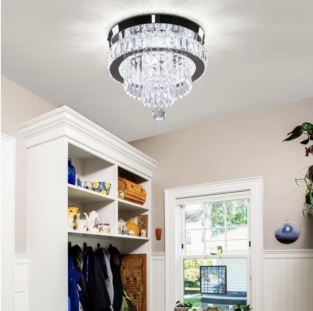 LED crystal flush mount ceiling light above a living room armchair