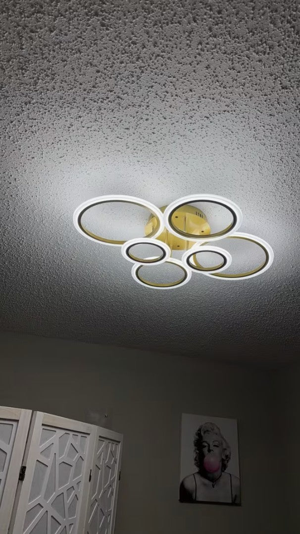 Gold LED ring ceiling light installed in a real home