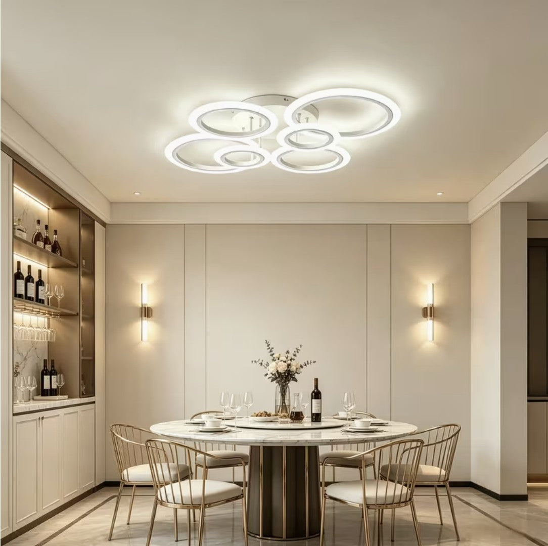 White LED ring ceiling light above a round dining table