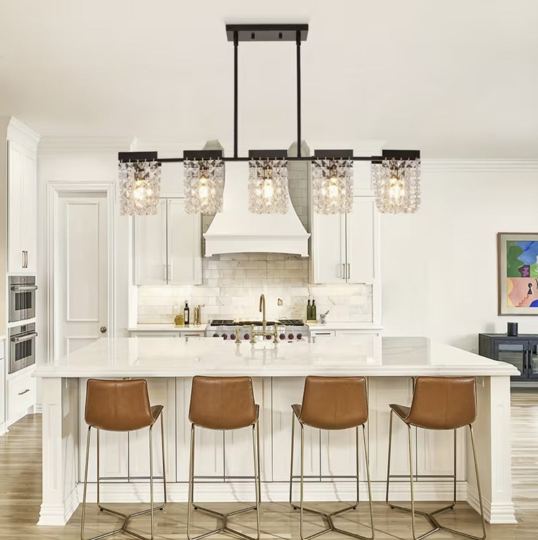 Black linear chandelier above a kitchen island