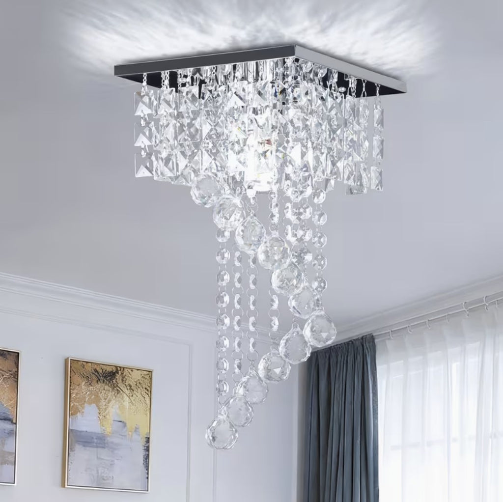 Mini crystal chandelier in a modern room with grey curtains