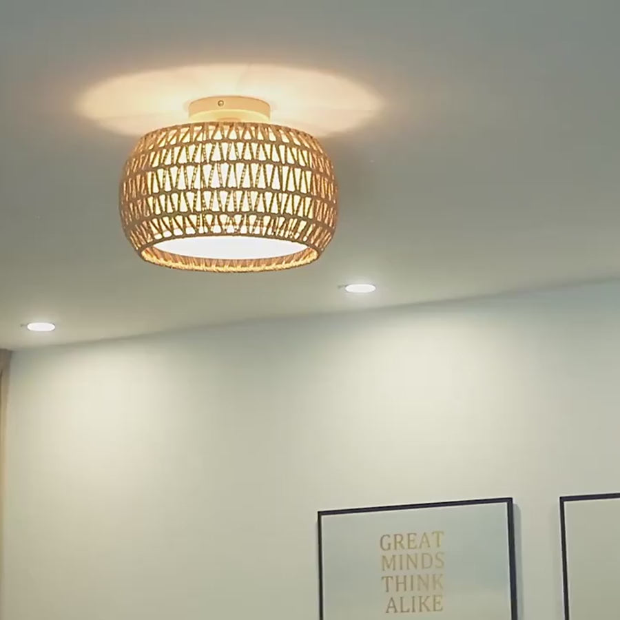 Farmhouse flush mount ceiling light filmed lit on a ceiling
