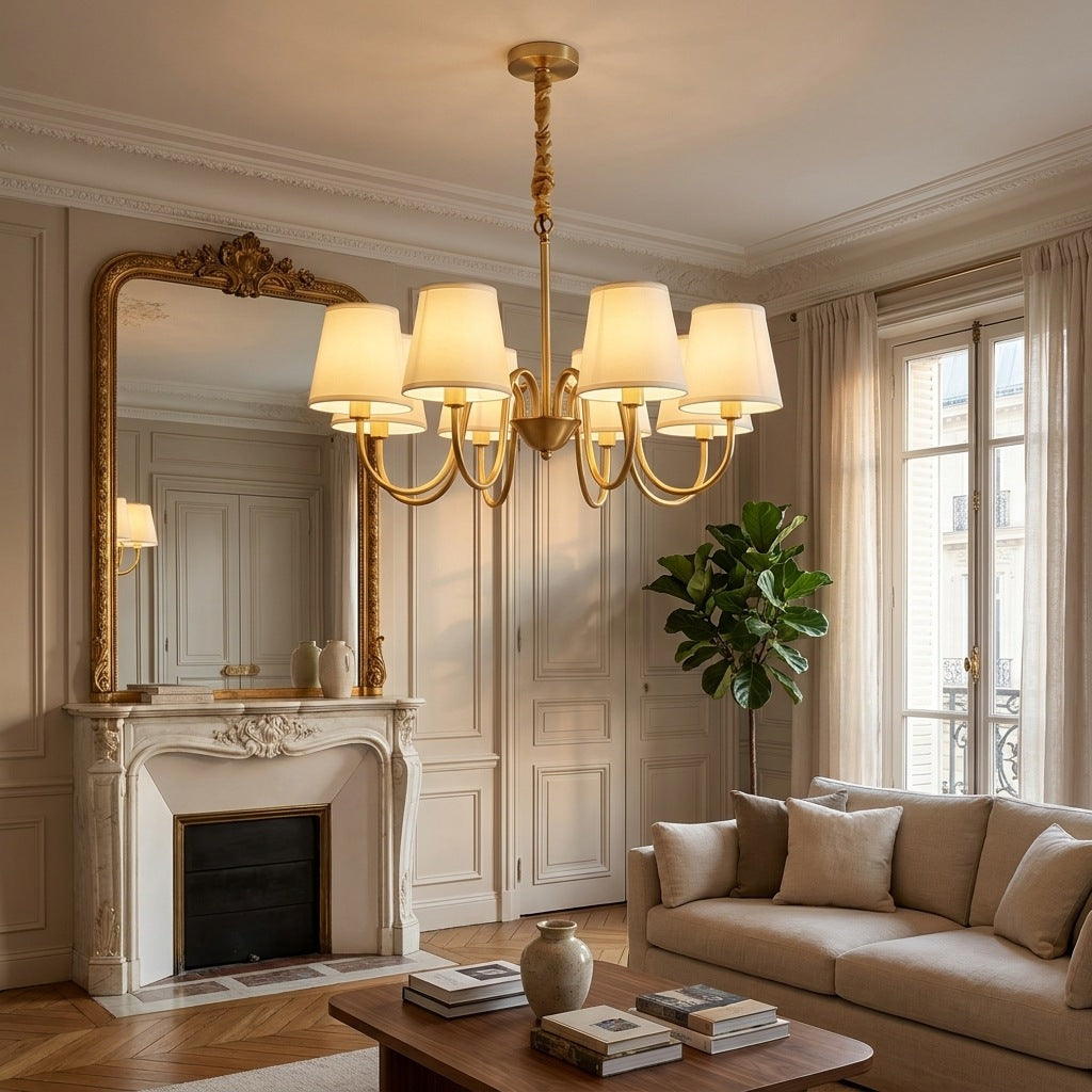 Vintage brass chandelier lit in a Haussmann living room above a marble fireplace