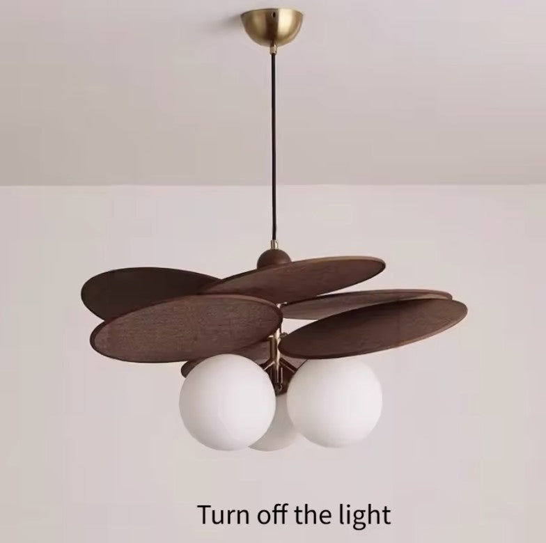 Walnut disc pendant light switched off