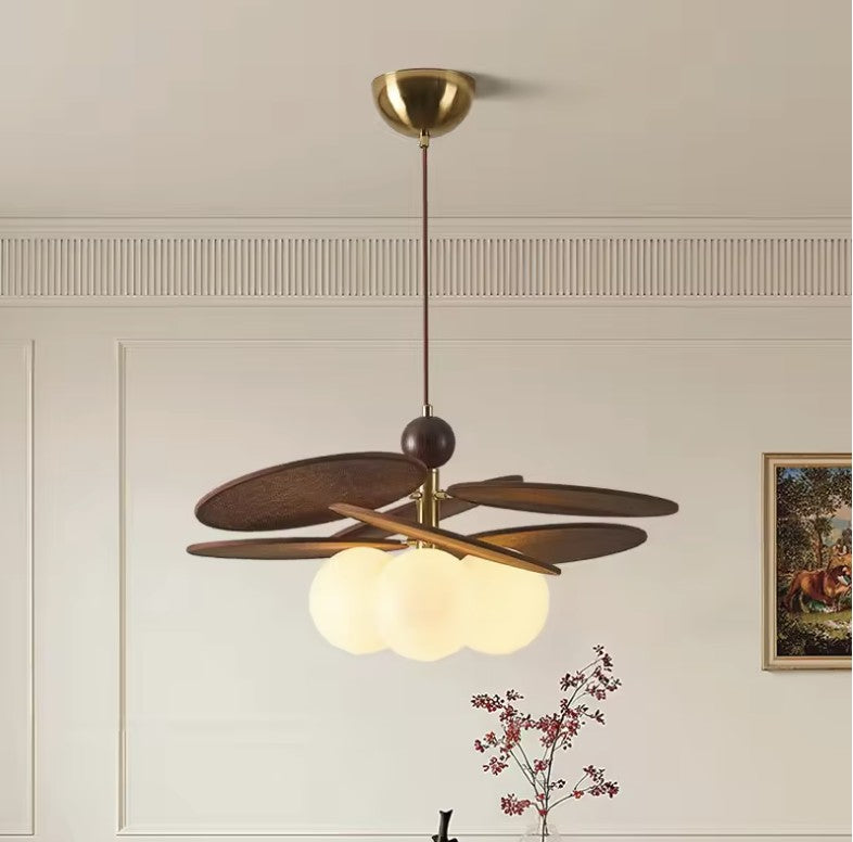 Walnut disc pendant light in a room with panelled walls