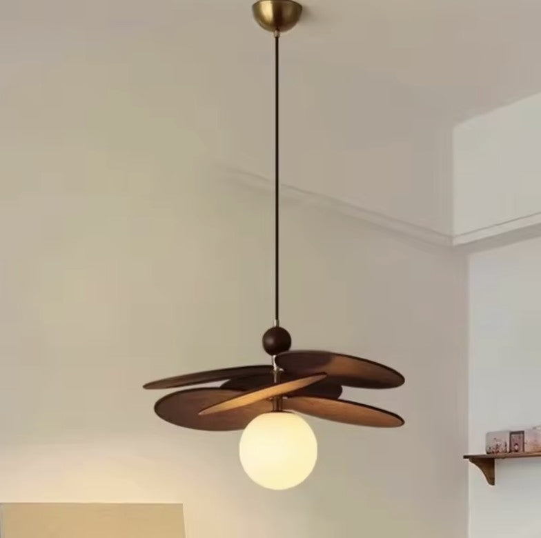 Walnut disc pendant light with a single opal glass globe
