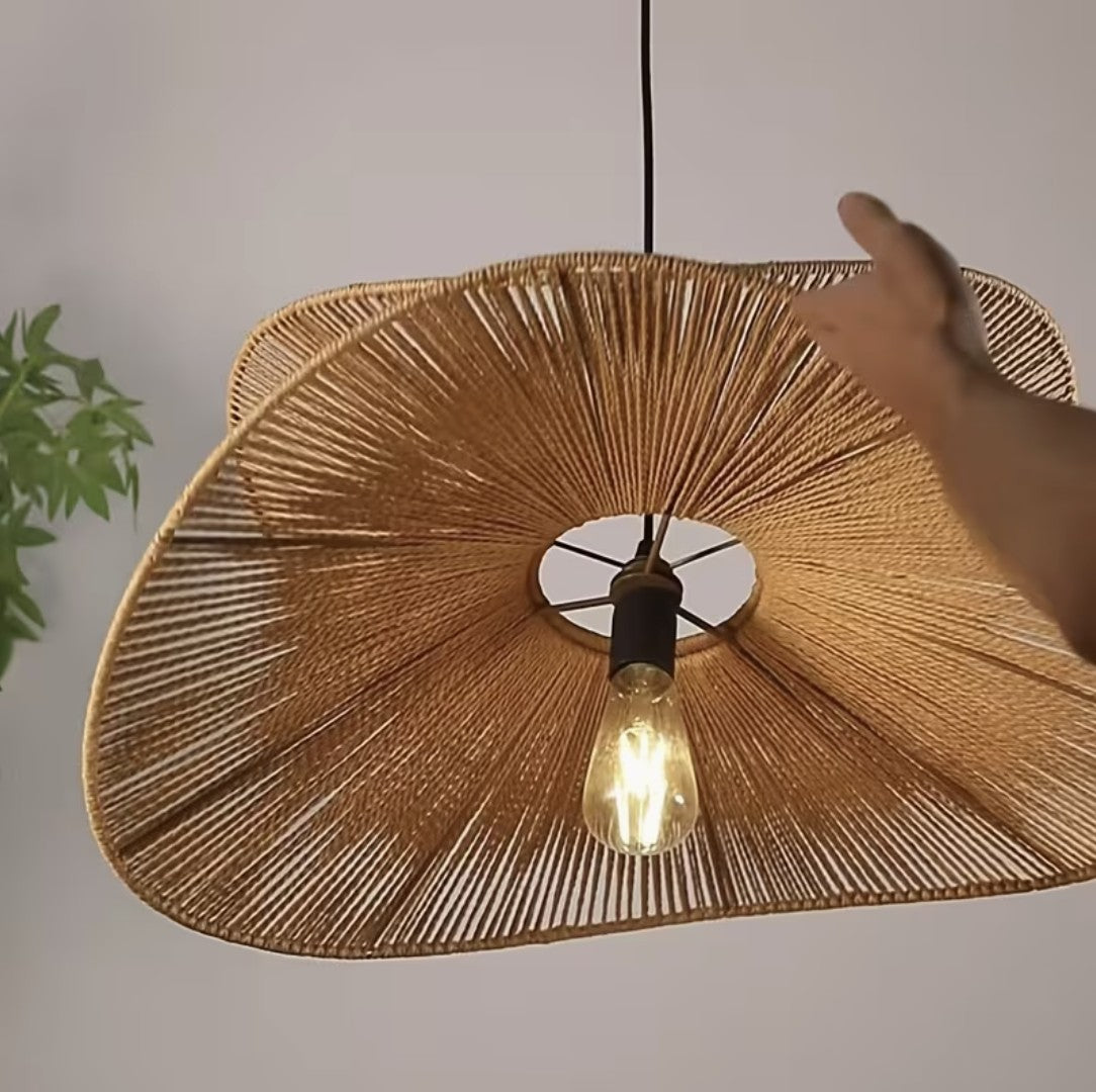Underside of the boho woven pendant light with its filament bulb Image